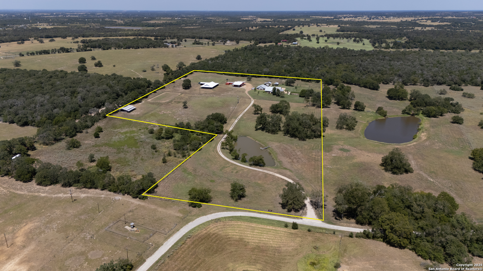 9560 Old Colony Line Road Dale, TX 78616 - Photo 2 of 41 an aerial view of a house with a lake view