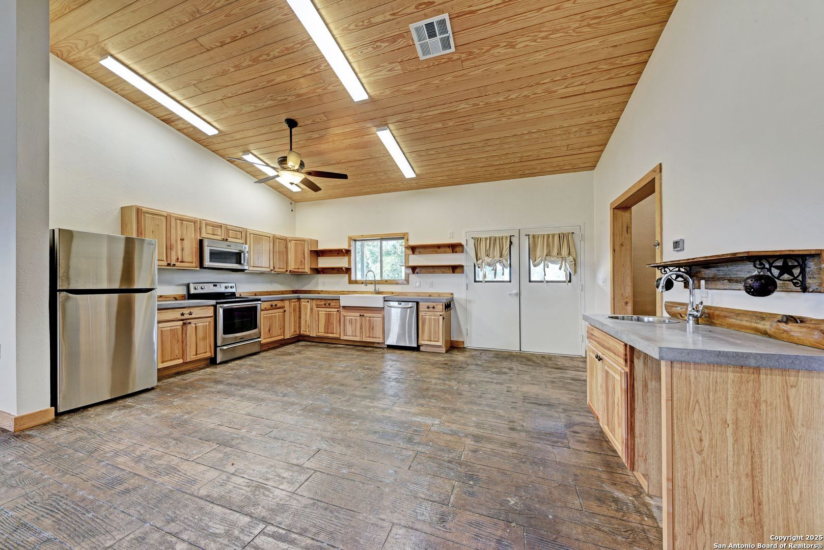 9560 Old Colony Line Road Dale, TX 78616 - Photo 28 of 41 a large kitchen with stainless steel appliances granite countertop lots of counter top space