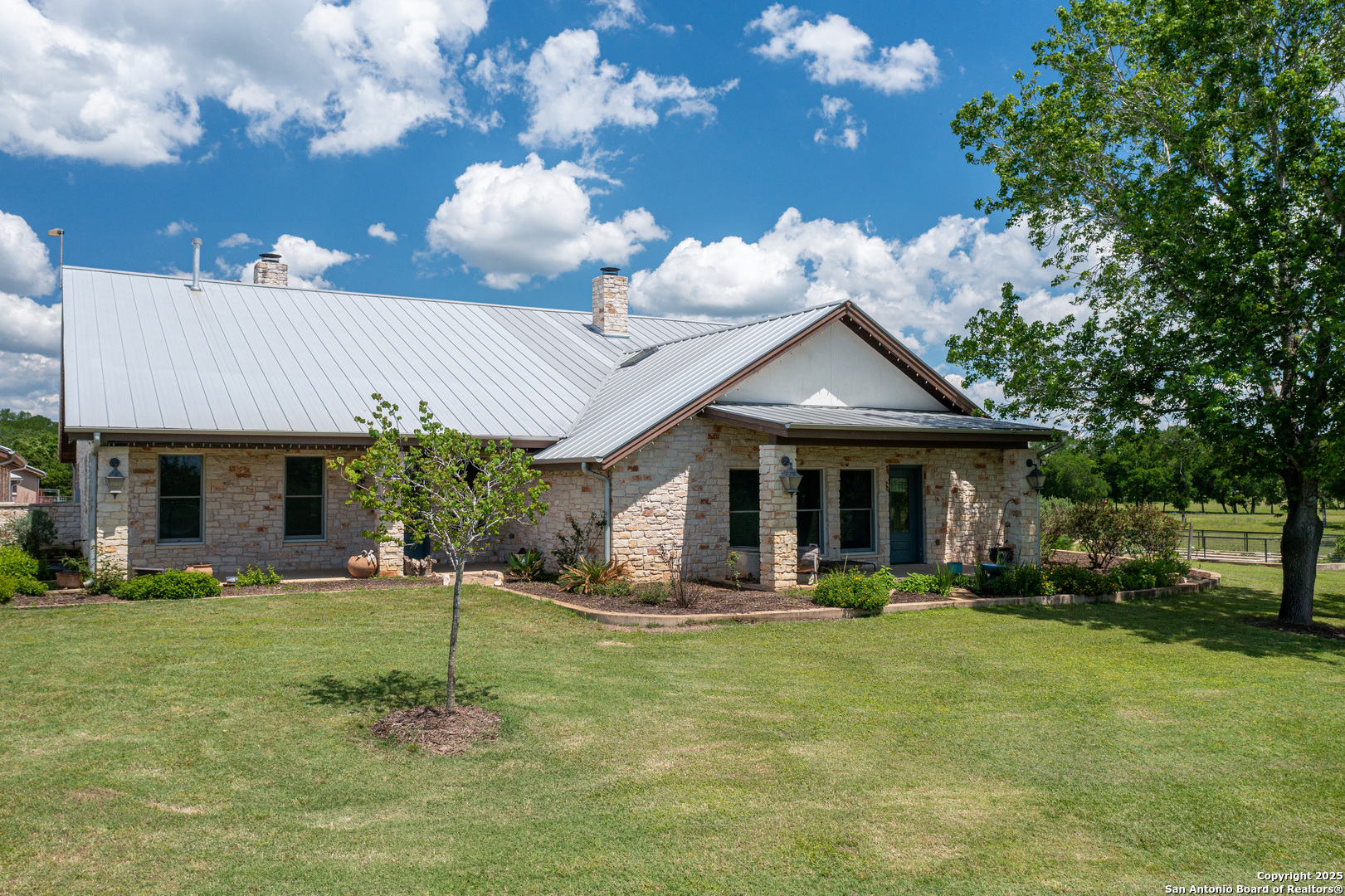 9560 Old Colony Line Road Dale, TX 78616 - Photo 3 of 41 a front view of a house with garden and patio