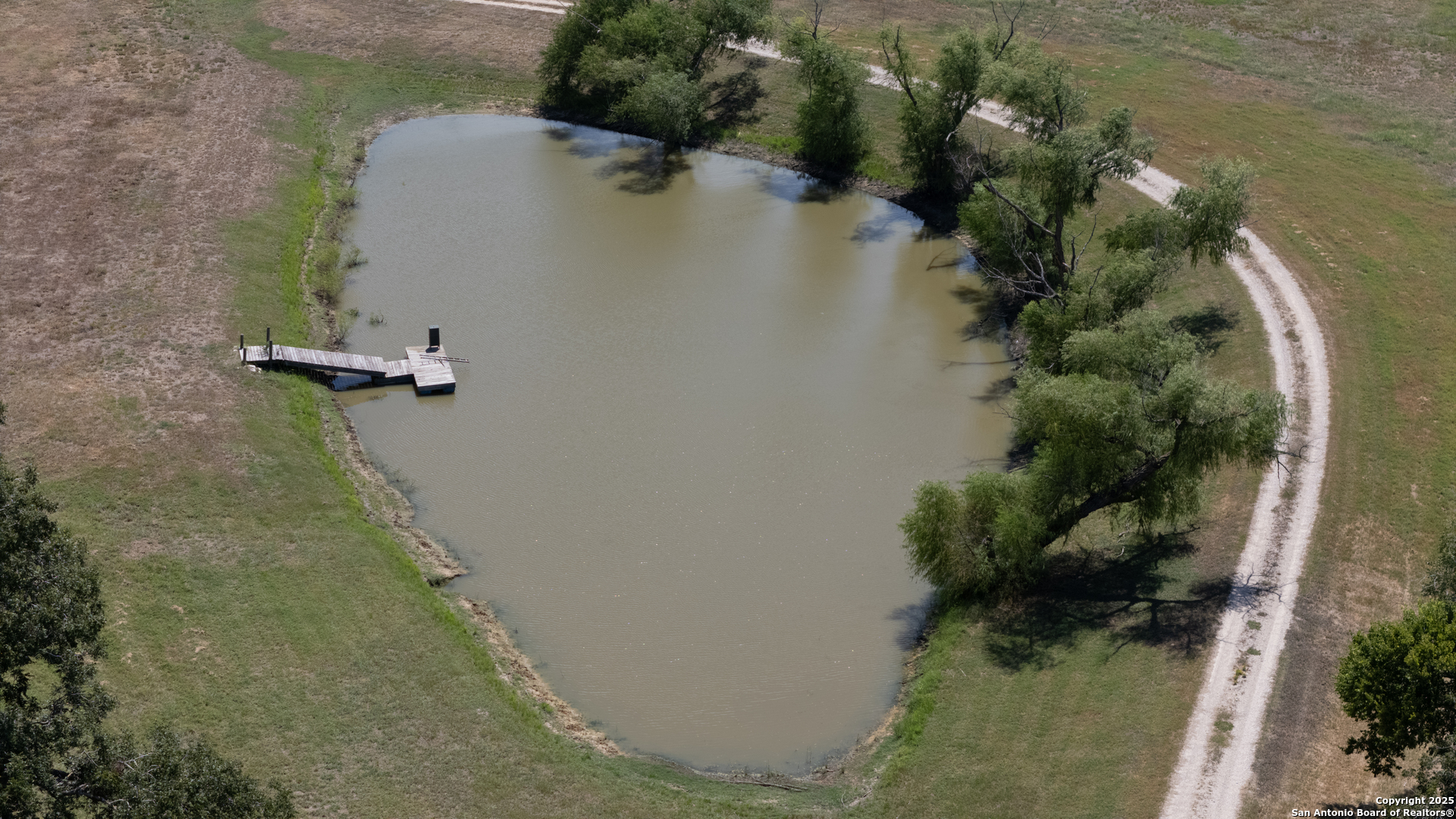 9560 Old Colony Line Road Dale, TX 78616 - Photo 35 of 41 an aerial view of a house with a yard and lake view