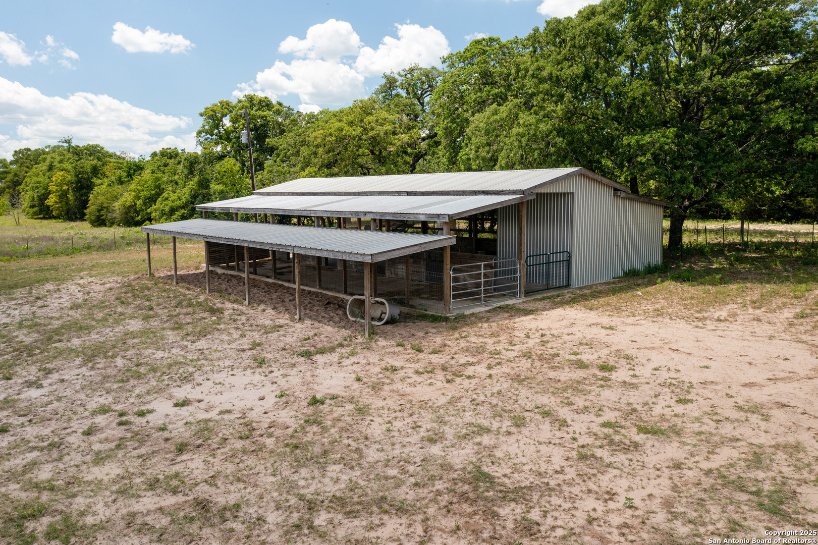 9560 Old Colony Line Road Dale, TX 78616 - Photo 40 of 41 a view of a house with a backyard and a patio