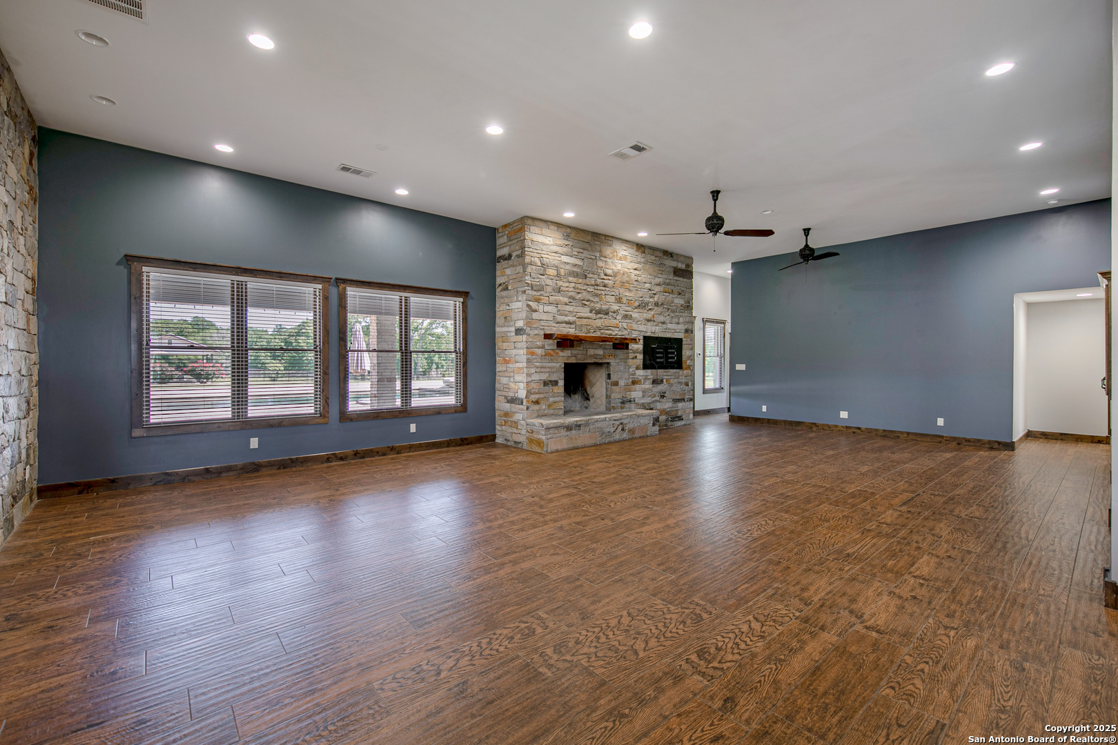 9560 Old Colony Line Road Dale, TX 78616 - Photo 10 of 41 an empty room with windows and fireplace