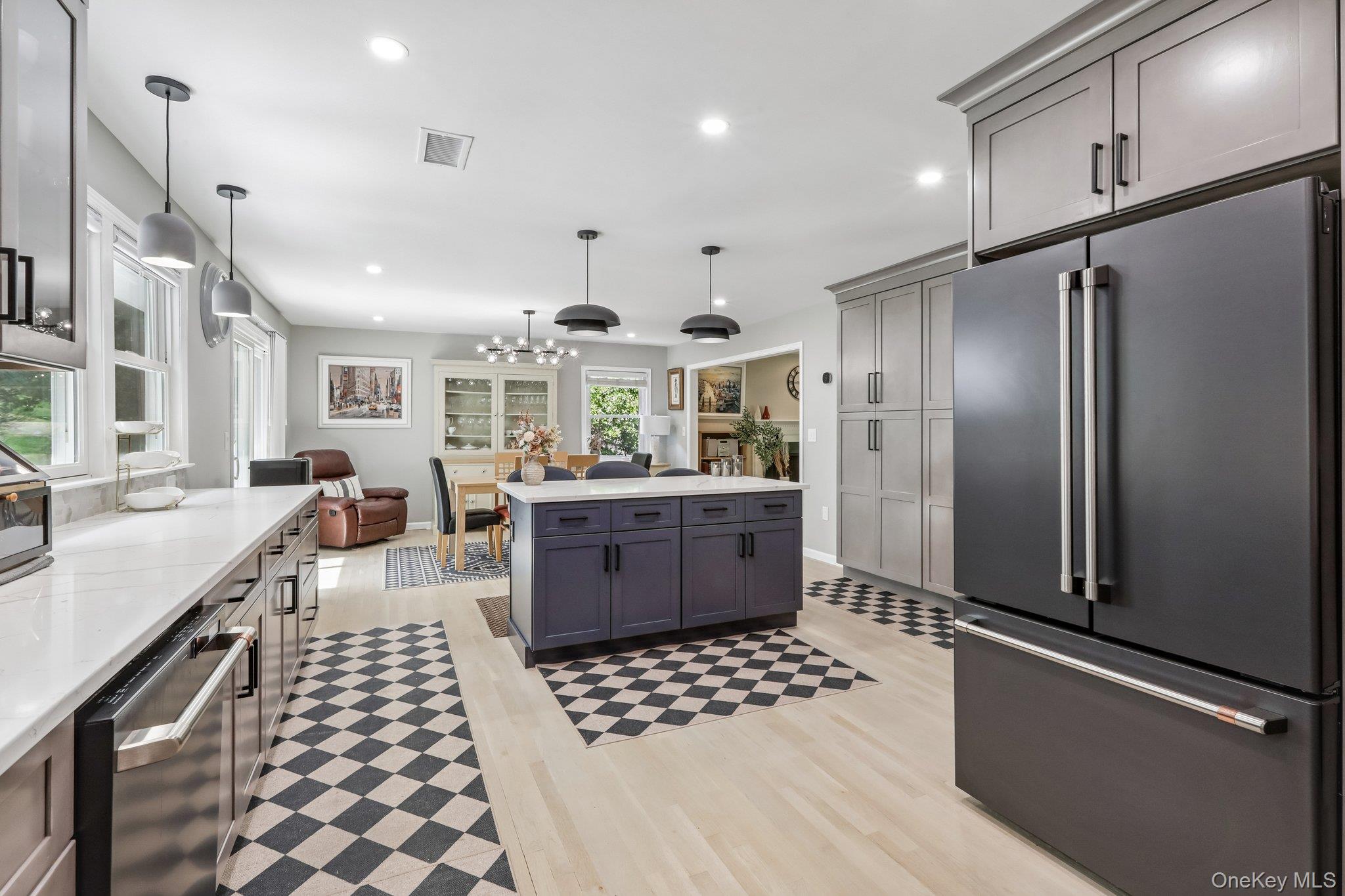 62 Mohegan Road Larchmont, NY 10538 - Photo 28 of 46 a kitchen with stainless steel appliances kitchen island granite countertop a refrigerator and a sink