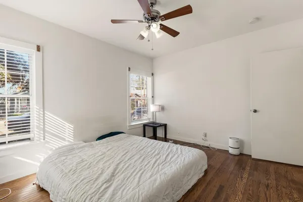 a bedroom with a bed and a window