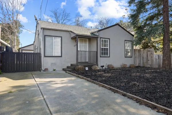 a house with trees in the background