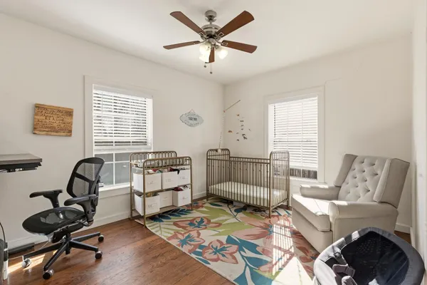 a work room with furniture and windows