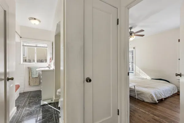 a bedroom with a bed and a view of bathroom