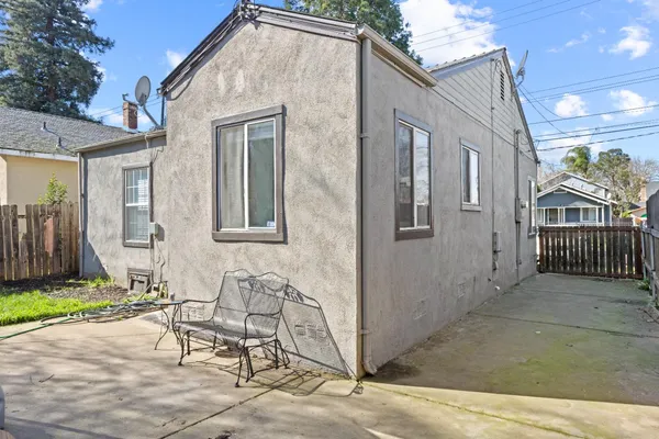a front view of a house with outdoor seating