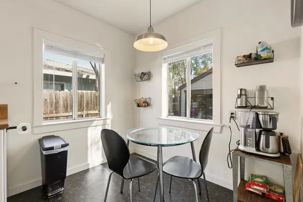 a view of a dining room with furniture window and outside view