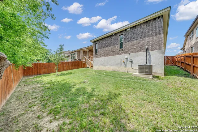 a view of a back yard of the house