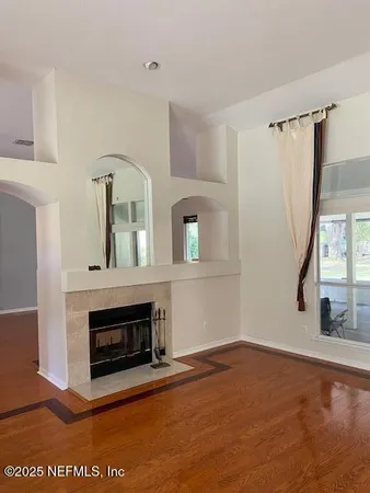 a view of livingroom with furniture and a fireplace