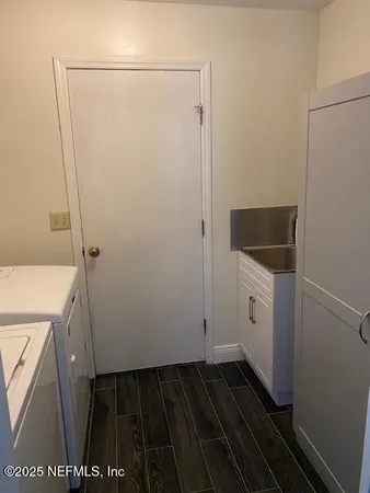 a bathroom with a sink and shower