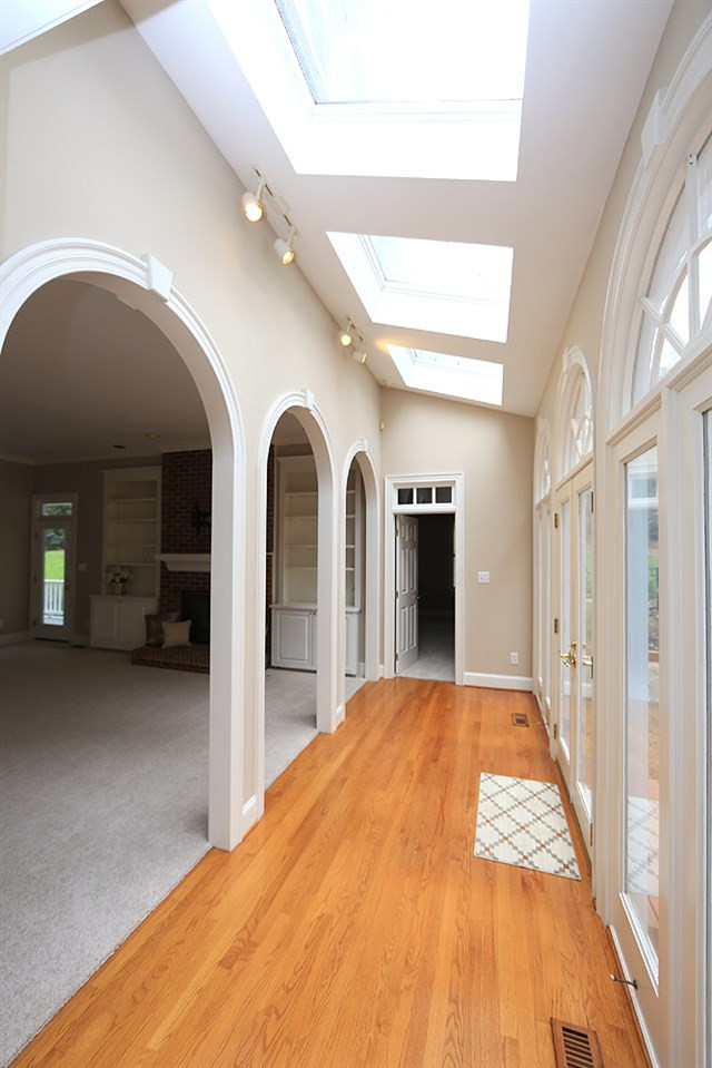 8617 Cold Springs Road Raleigh, NC 27615 - Photo 10 of 30 This hallway leads to the 1st floor guest suite. Open Hallway