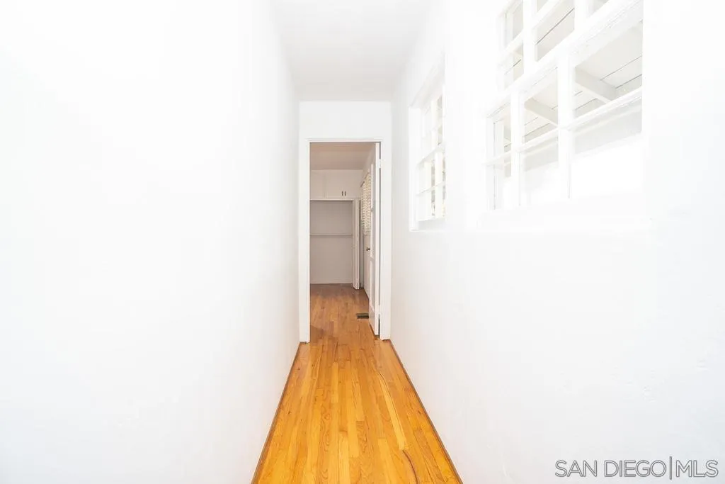 527 Forward Street La Jolla, CA 92037 - Photo 25 of 42 a view of a hallway with wooden floor