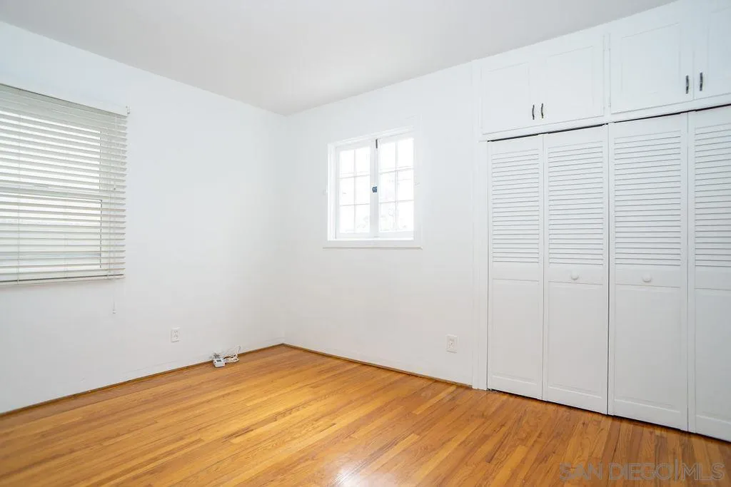 527 Forward Street La Jolla, CA 92037 - Photo 27 of 42 a view of empty room with wooden floor and fan