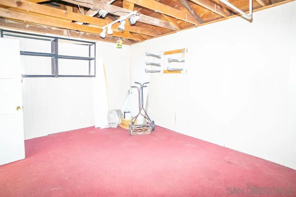 527 Forward Street La Jolla, CA 92037 - Photo 34 of 42 a view of a room with a window and a ceiling fan