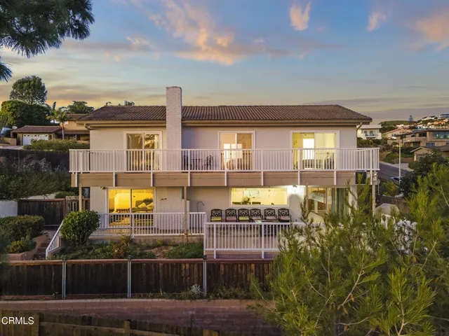 a view of a swimming pool with furniture