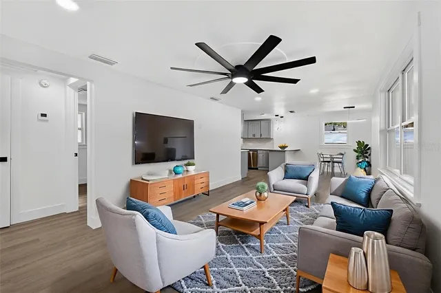 a living room with furniture rug and window