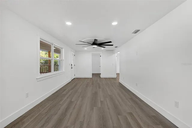 a kitchen with stainless steel appliances a stove a sink a refrigerator and cabinets