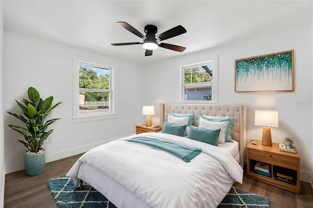 an aerial view of town with residential houses with outdoor space and trees