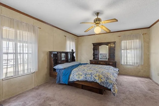a bedroom with a bed and window