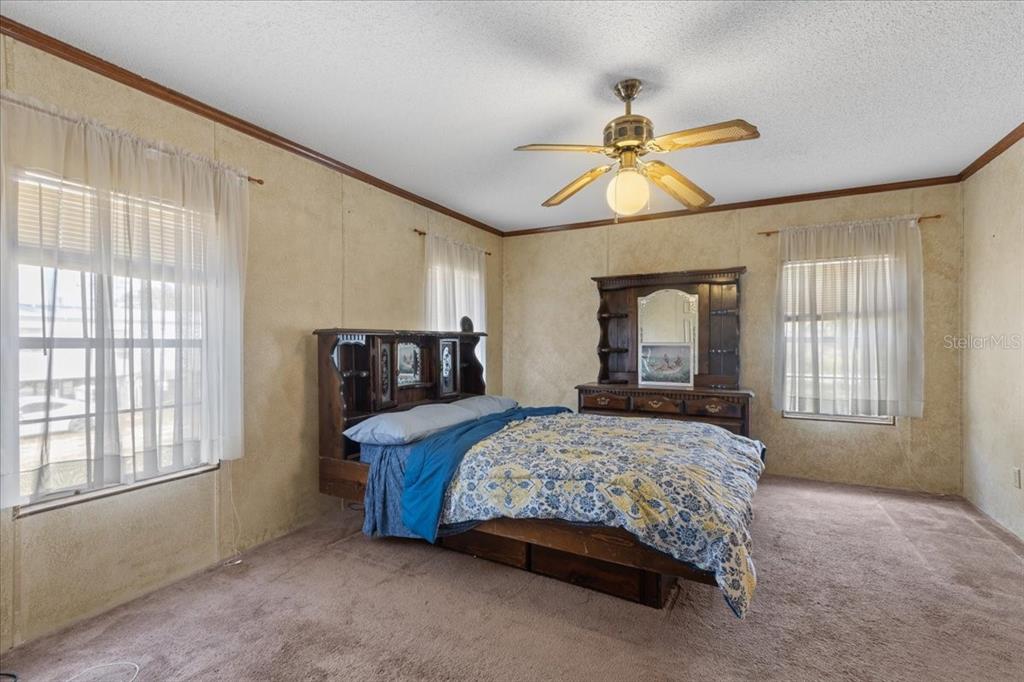 4945 Southwest Highway 358 Steinhatchee, FL 32359 - Photo 13 of 35 a bedroom with a bed and window