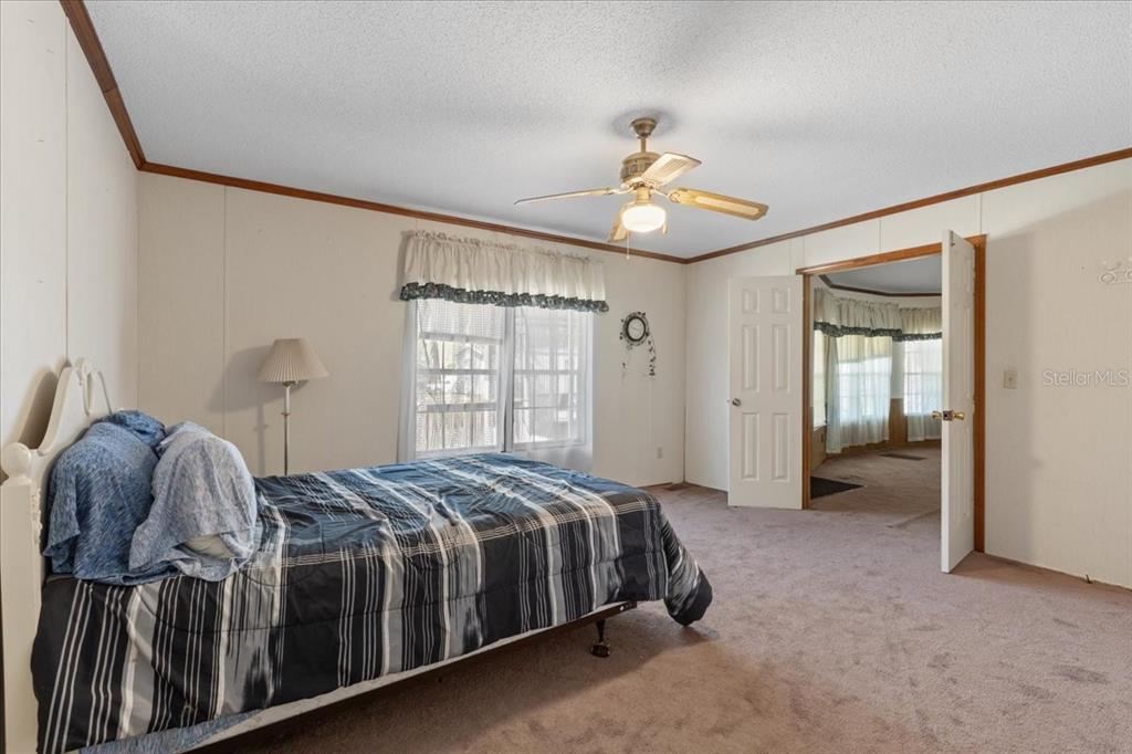 4945 Southwest Highway 358 Steinhatchee, FL 32359 - Photo 16 of 35 a bedroom with a bed and a window