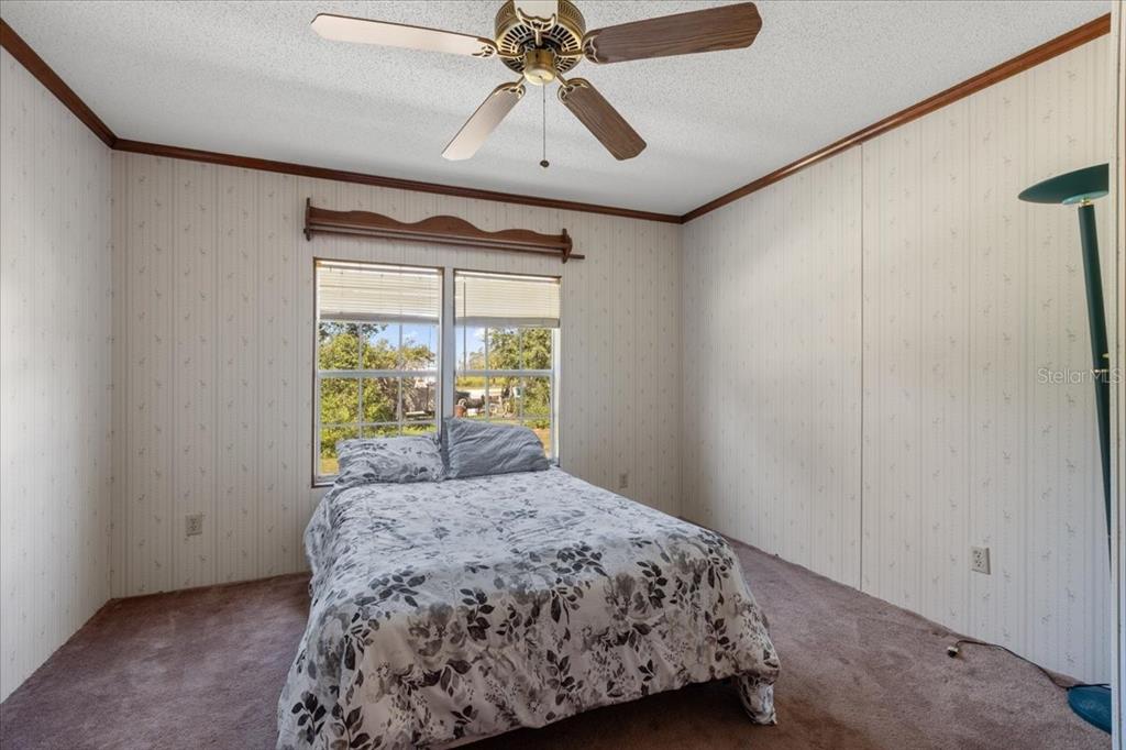 4945 Southwest Highway 358 Steinhatchee, FL 32359 - Photo 21 of 35 a bedroom with a bed and a window