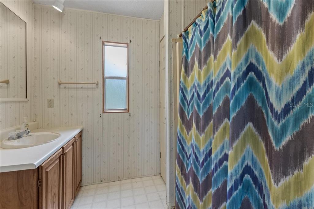 4945 Southwest Highway 358 Steinhatchee, FL 32359 - Photo 24 of 35 a bathroom with a sink and a mirror