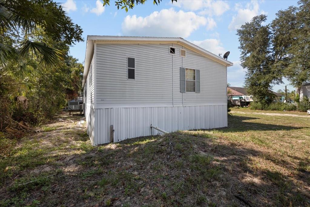 4945 Southwest Highway 358 Steinhatchee, FL 32359 - Photo 29 of 35 a view of a house with backyard and trees