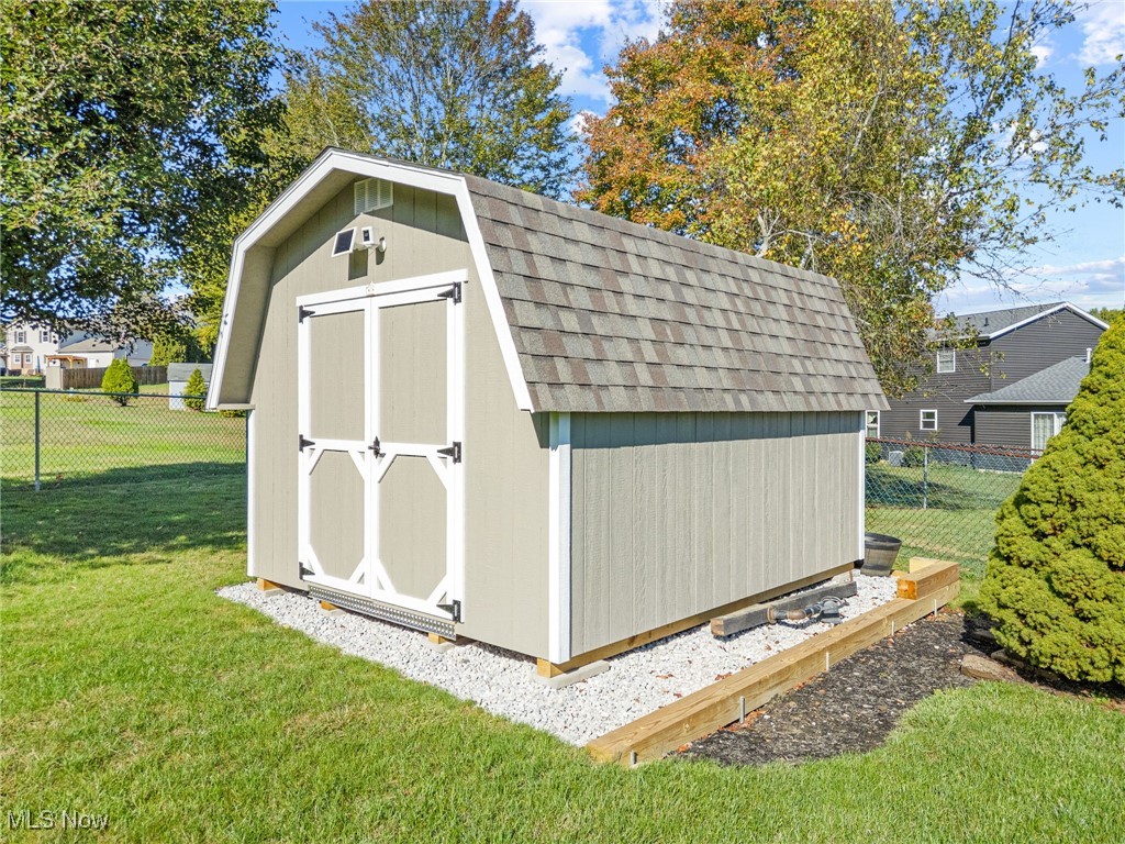 1521 Bravado Road Southwest Canton, OH 44706 - Photo 24 of 37 View of shed with a fenced backyard