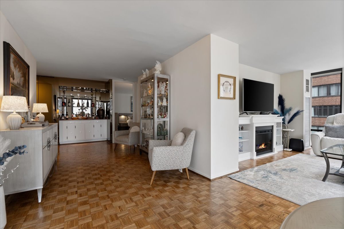 200 East Delaware Place, Unit 13C Chicago, IL 60611 - Photo 12 of 31 a living room with furniture and a flat screen tv