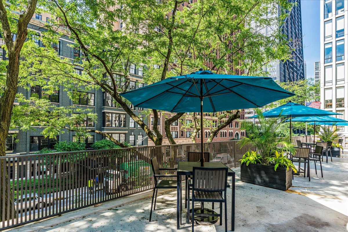 200 East Delaware Place, Unit 13C Chicago, IL 60611 - Photo 29 of 31 an outdoor view of patio with umbrella
