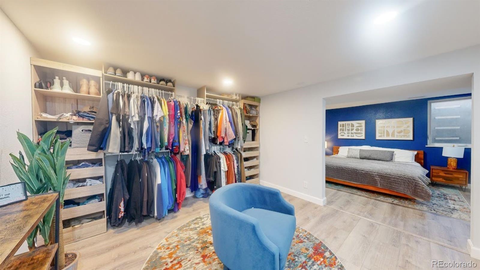 a living room with furniture and a walk in closet