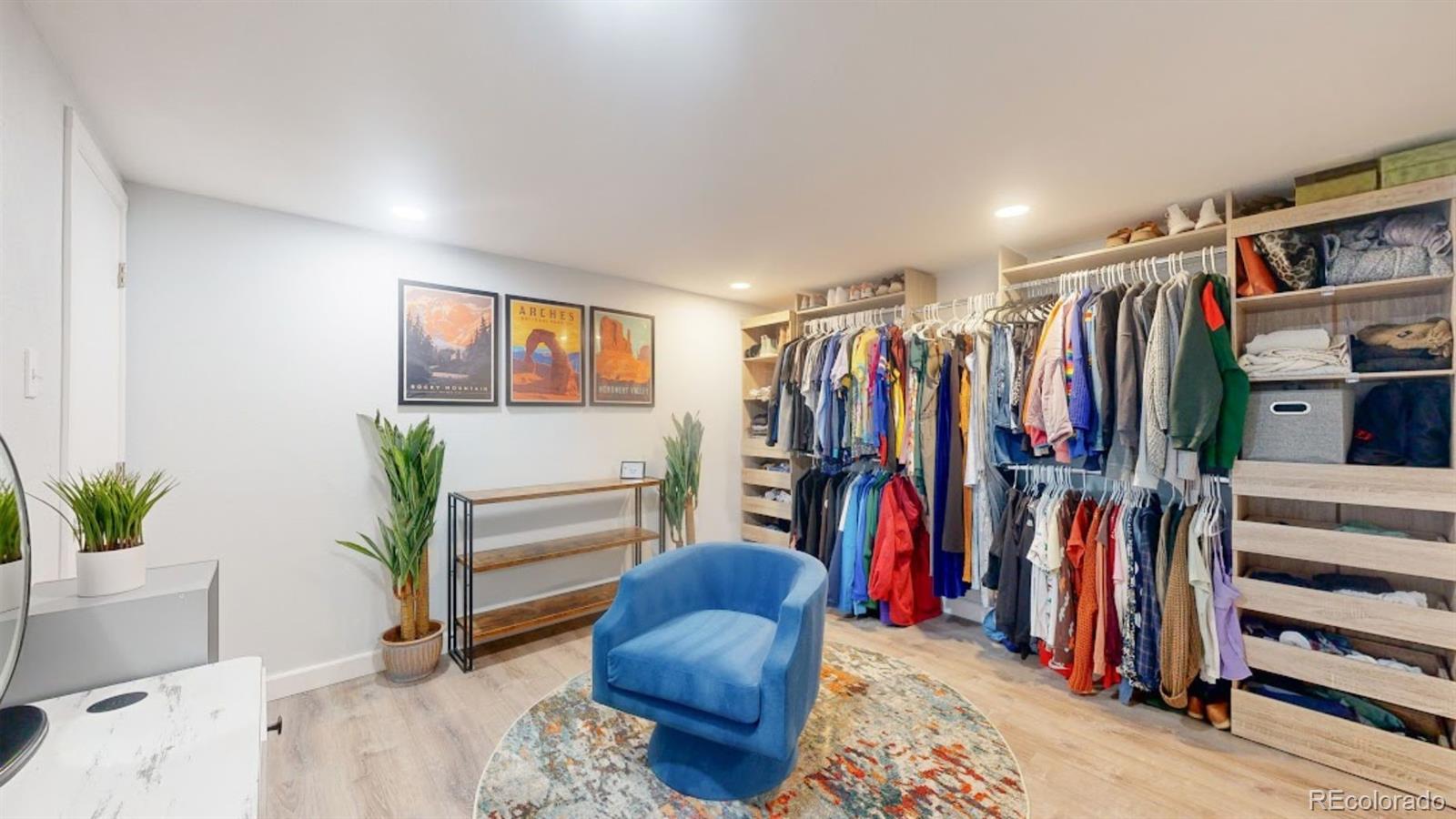 9420 Ridge Road Arvada, CO 80002 - Photo 12 of 31 a walk in closet with clothes and shoes