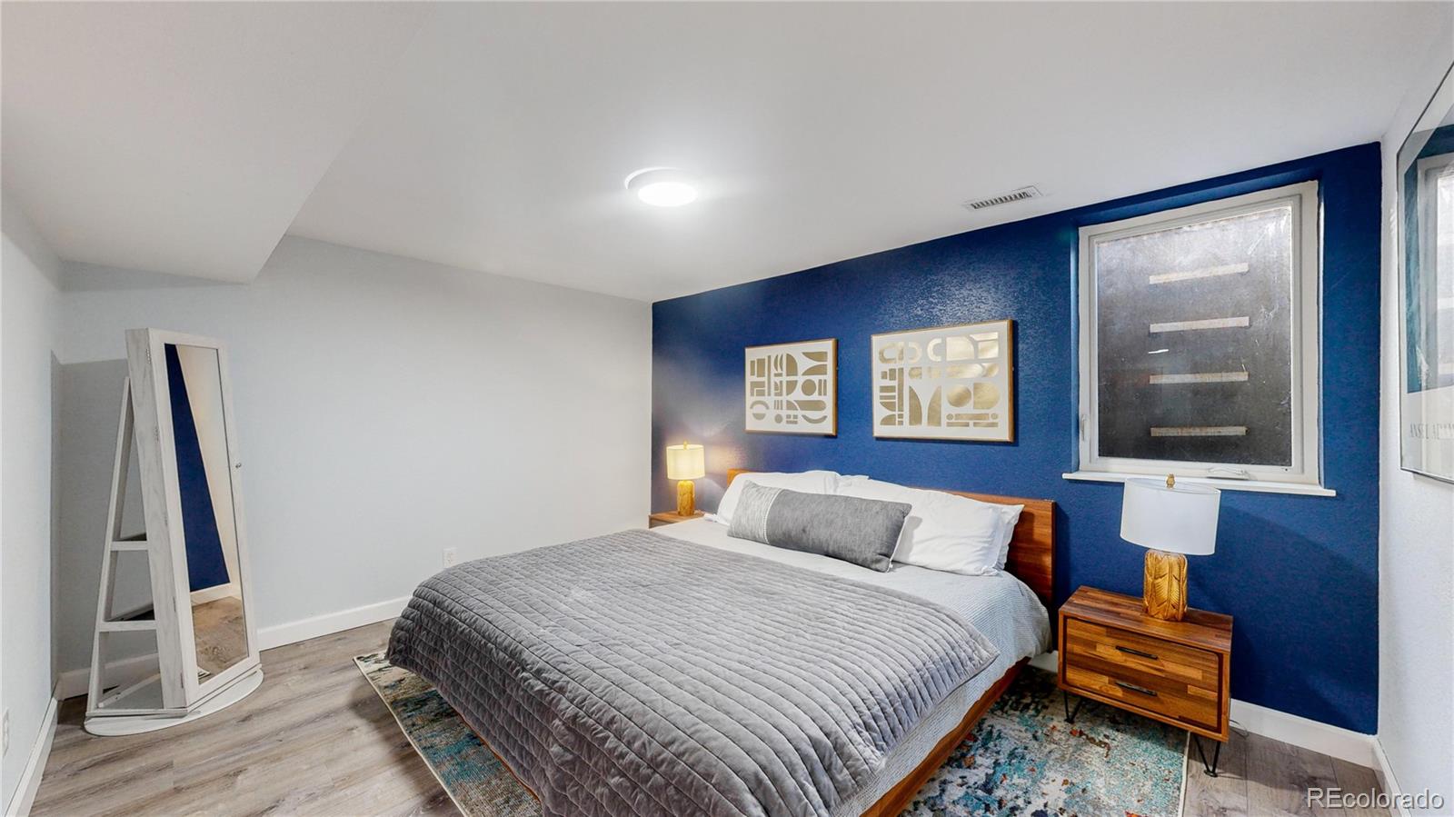 9420 Ridge Road Arvada, CO 80002 - Photo 13 of 31 a bedroom with a large bed and a window