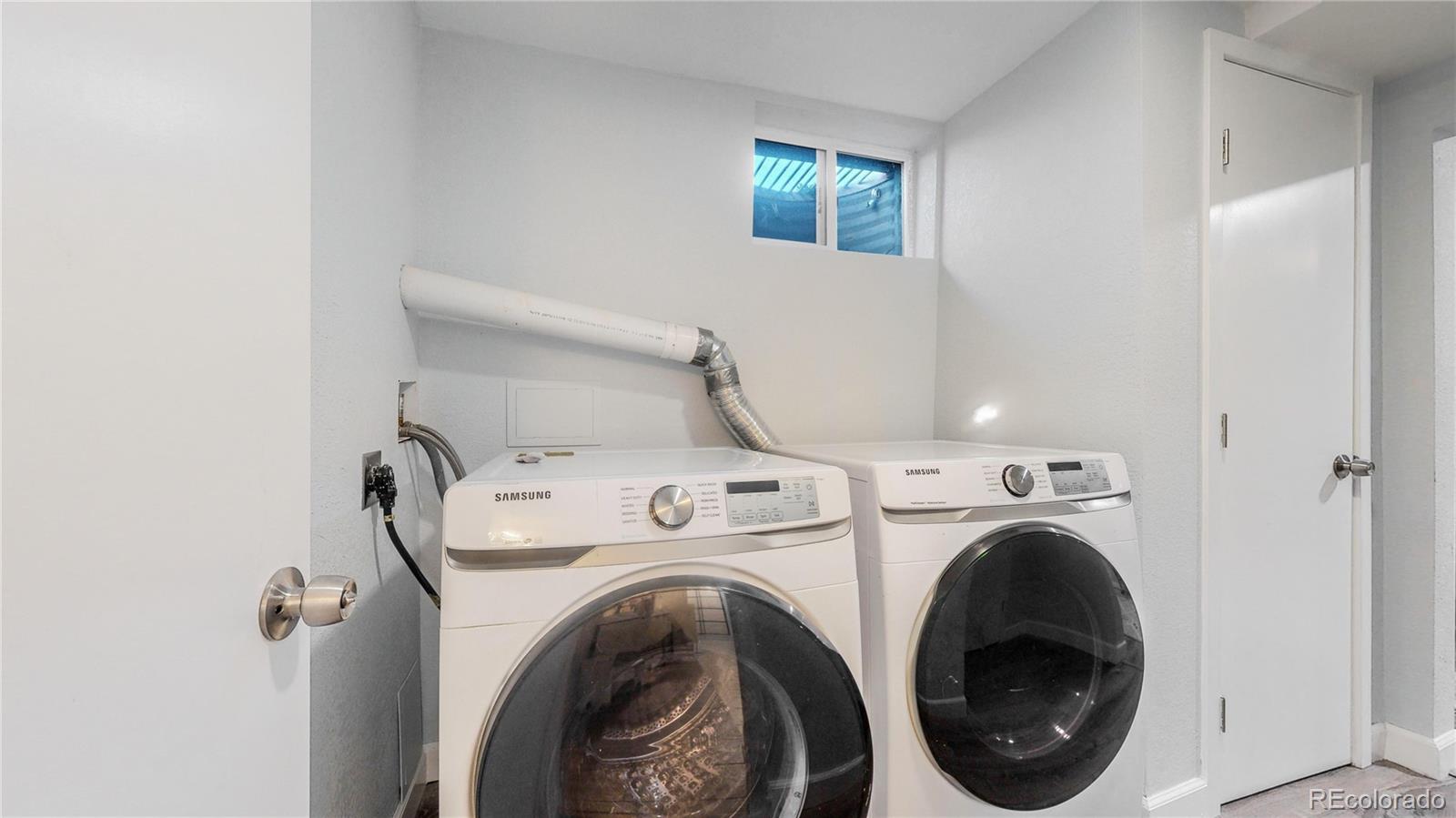9420 Ridge Road Arvada, CO 80002 - Photo 22 of 31 a utility room with dryer and washer