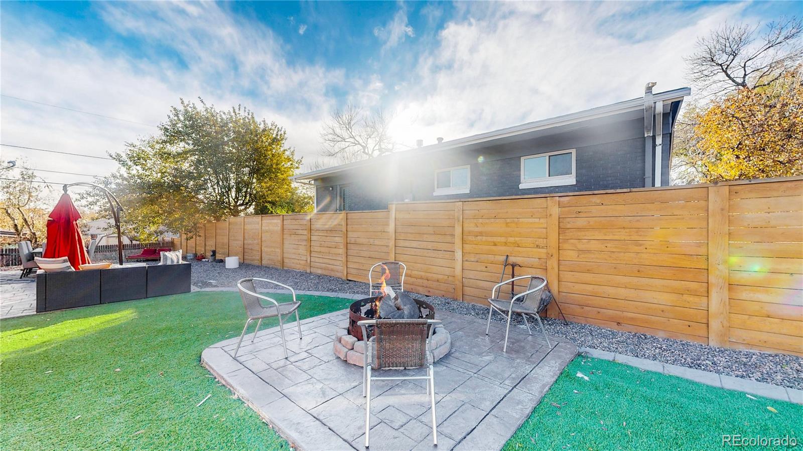 9420 Ridge Road Arvada, CO 80002 - Photo 24 of 31 a front view of a house with garden