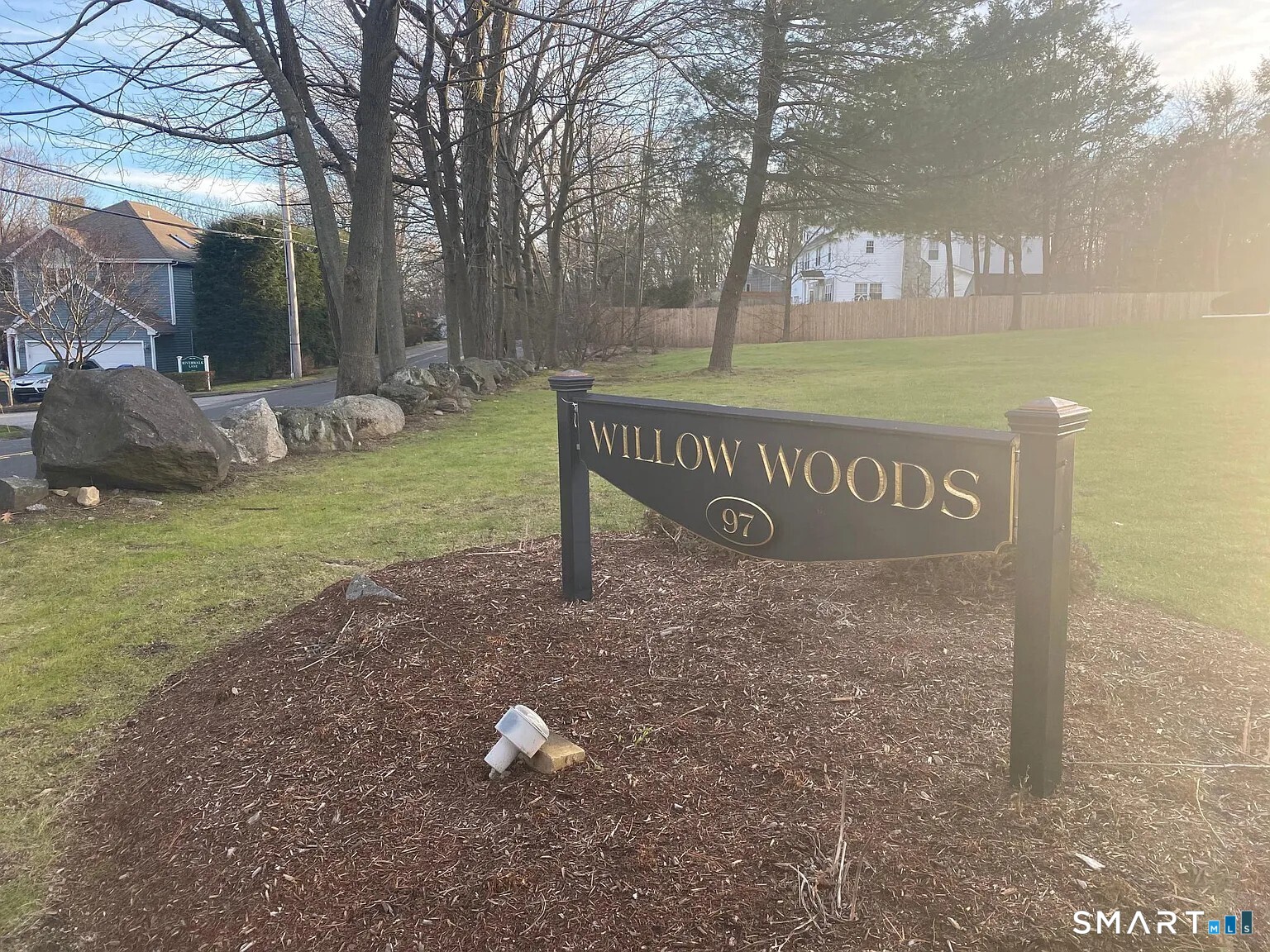 97 West Norwalk Road, Unit 8 Norwalk, CT 06850 - Photo 1 of 1 a view of a park that has a sign board large trees
