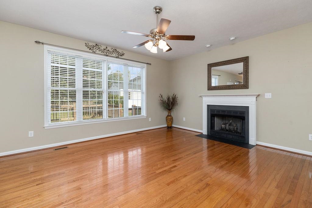 30 Sir Robin Road Waynesboro, VA 22980 - Photo 17 of 62 a view of an empty room with wooden floor fireplace and a window