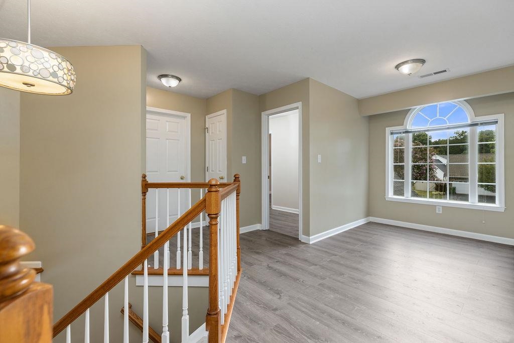 30 Sir Robin Road Waynesboro, VA 22980 - Photo 28 of 62 a view of an empty room with wooden floor and windows