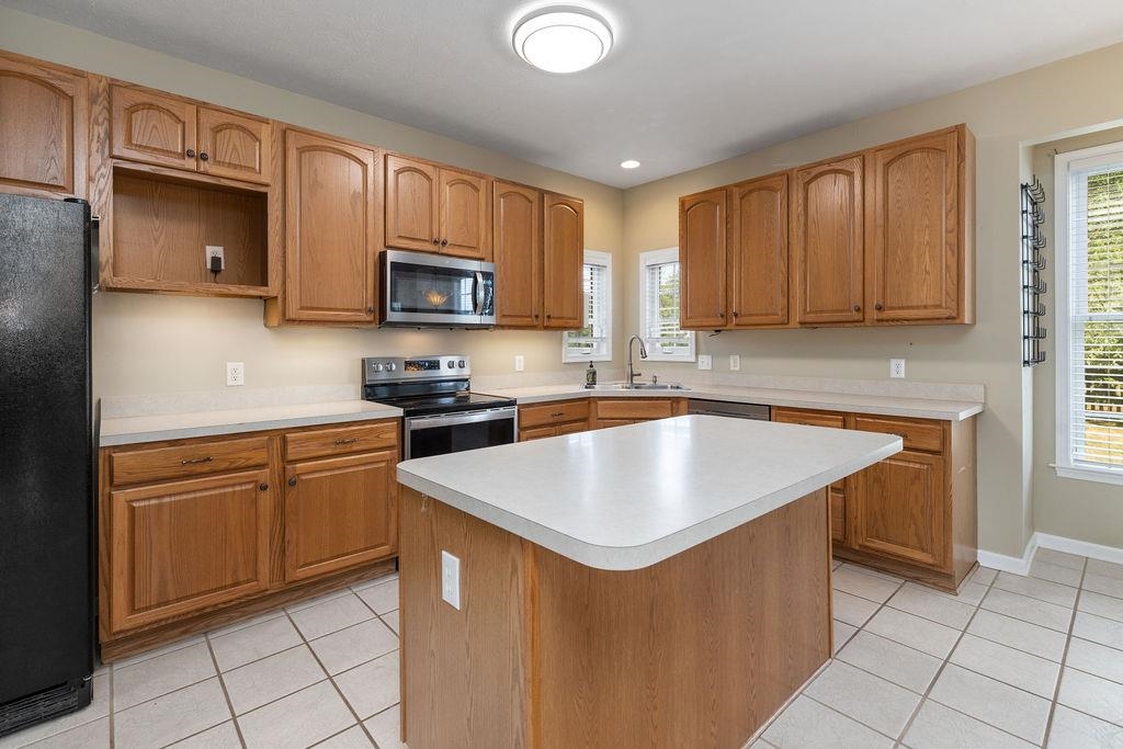 30 Sir Robin Road Waynesboro, VA 22980 - Photo 3 of 62 a kitchen with stainless steel appliances granite countertop a sink stove microwave and refrigerator