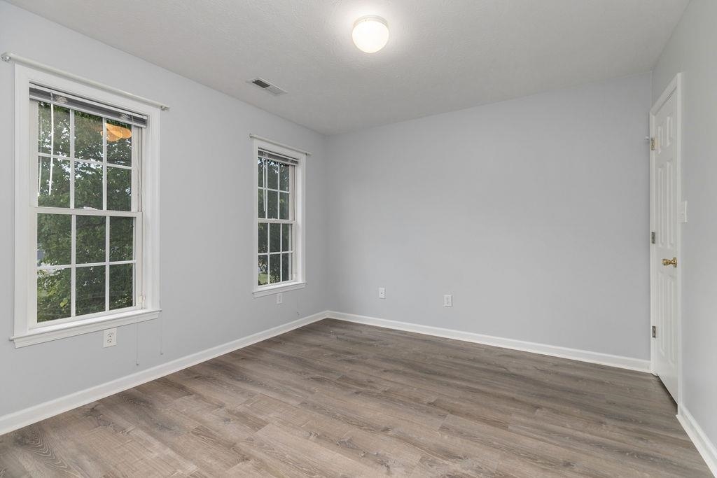 30 Sir Robin Road Waynesboro, VA 22980 - Photo 34 of 62 a view of an empty room with wooden floor and windows