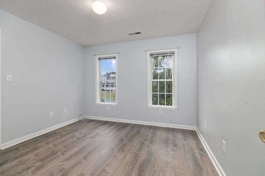 30 Sir Robin Road Waynesboro, VA 22980 - Photo 35 of 62 an empty room with wooden floor and windows