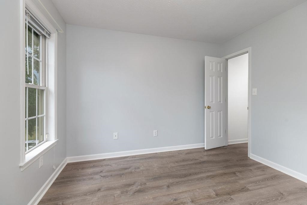 30 Sir Robin Road Waynesboro, VA 22980 - Photo 36 of 62 a view of an empty room with wooden floor and a window