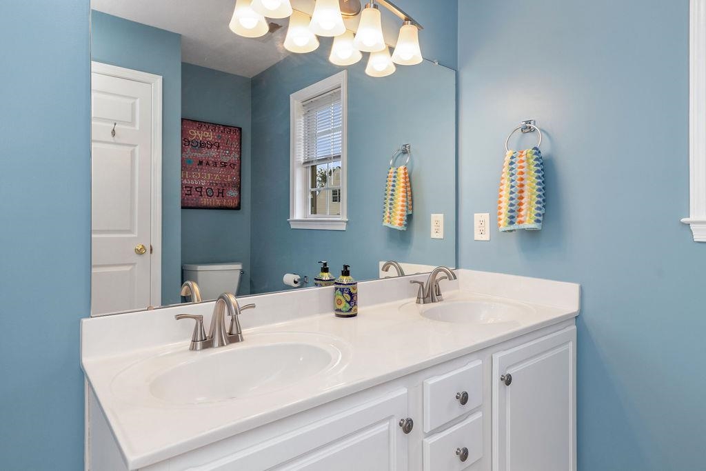 30 Sir Robin Road Waynesboro, VA 22980 - Photo 38 of 62 a bathroom with a sink and a mirror