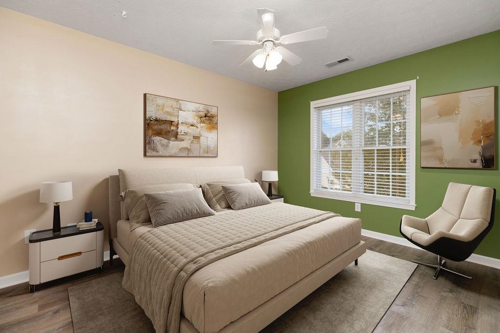 30 Sir Robin Road Waynesboro, VA 22980 - Photo 40 of 62 a spacious bedroom with a bed and a couch
