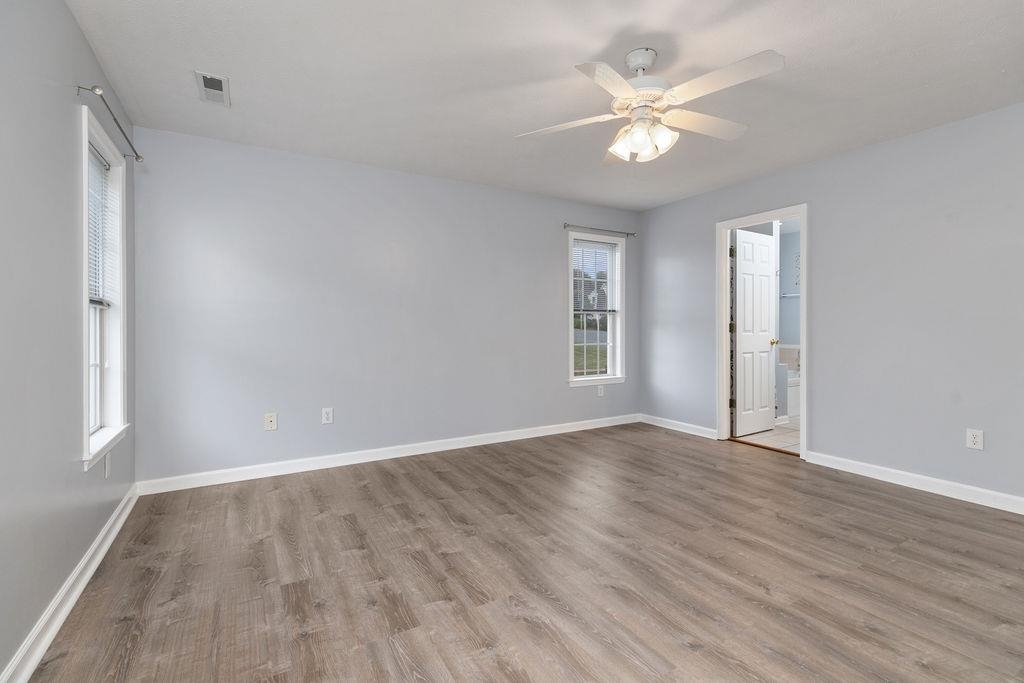 30 Sir Robin Road Waynesboro, VA 22980 - Photo 46 of 62 an empty room with wooden floor and ceiling fan