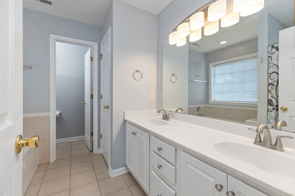 30 Sir Robin Road Waynesboro, VA 22980 - Photo 47 of 62 a spacious bathroom with a double vanity sink mirror and bathtub