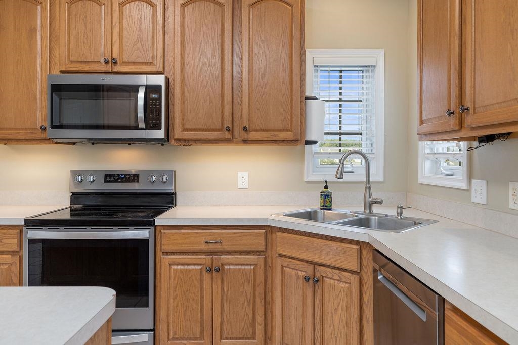 30 Sir Robin Road Waynesboro, VA 22980 - Photo 5 of 62 a kitchen with stainless steel appliances a stove a microwave a sink and cabinets